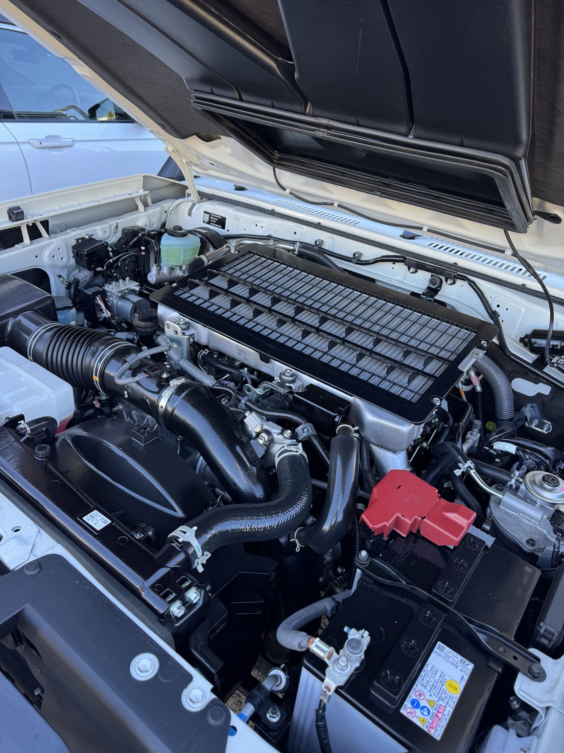 Clean engine bay following chassis protection service